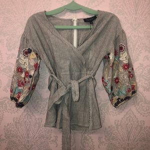 Gray/ white stripped wrap shirt with flower detail